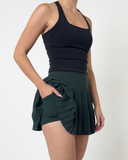 pockets of the green pleated tennis skirt